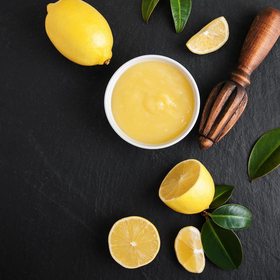 Lemon curd  with fresh lemons photo