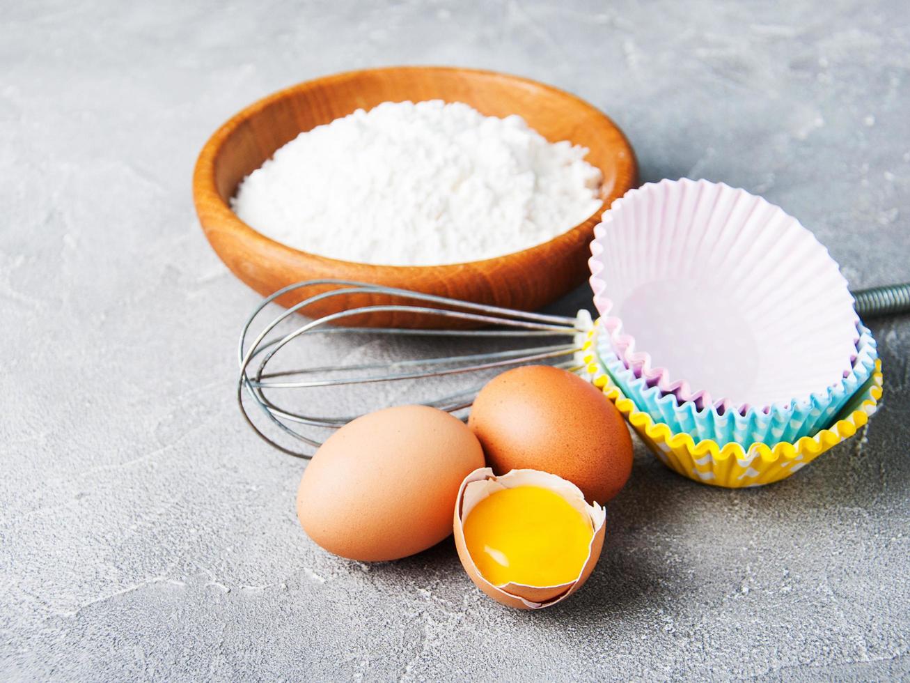 Baking ingredients - flour and eggs photo