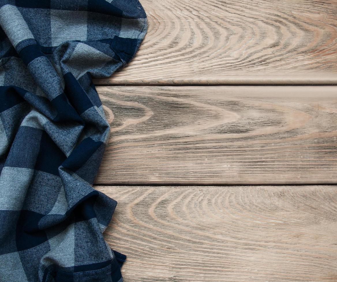 Checkered napkin on a wooden background photo