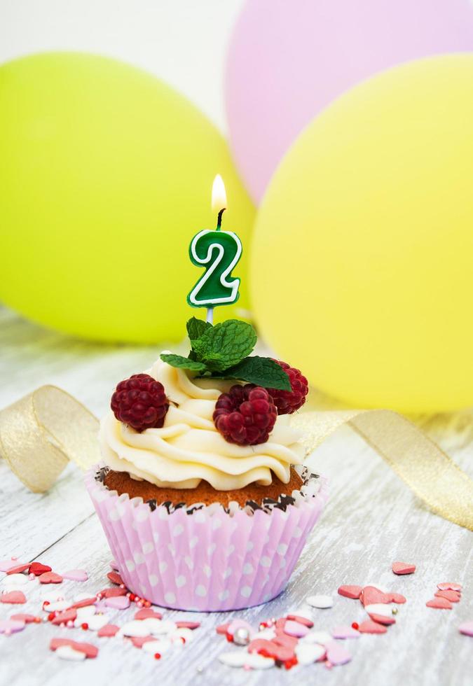 Cupcake with a numeral two candle photo