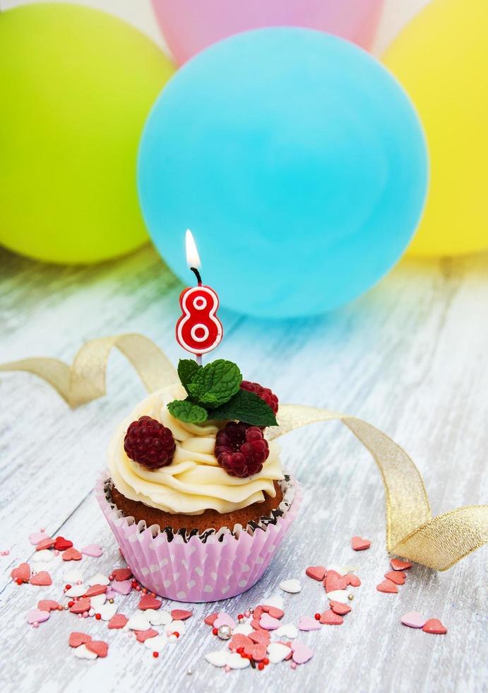 Cupcake with a numeral eigth candle photo