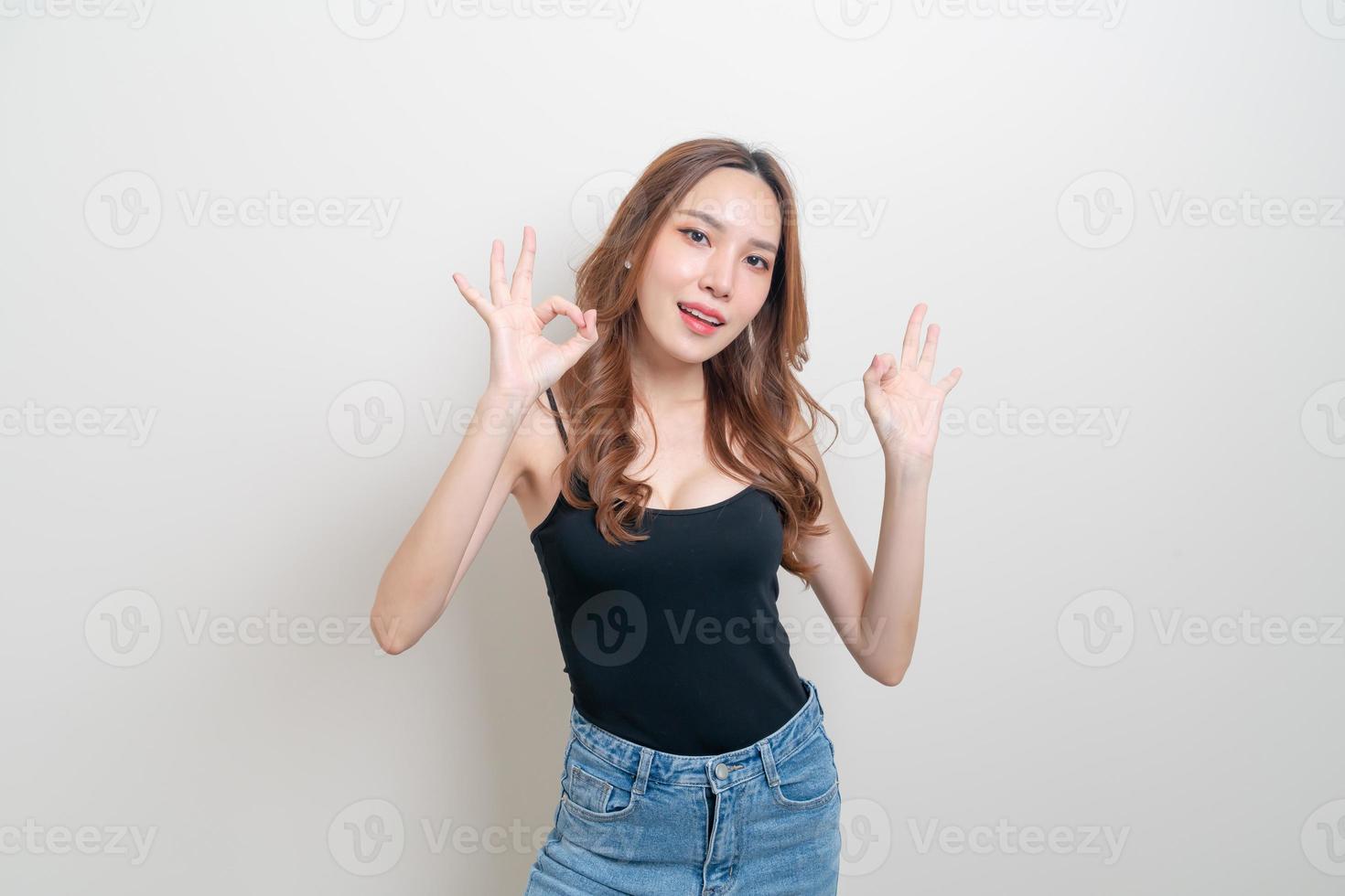 portrait beautiful woman with hand show ok or agree hand sign photo