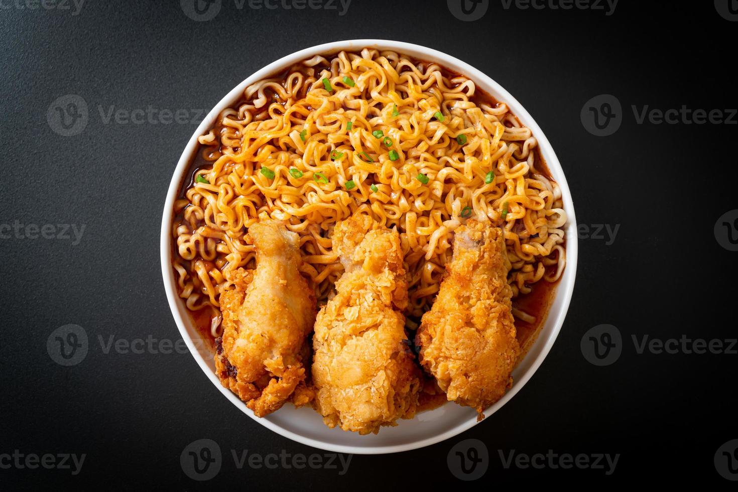 Korean instant noodles with fried chicken or Fried chicken ramyeon photo