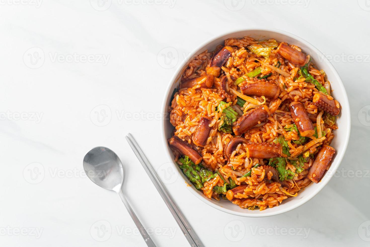 Stir-fried squid or octopus with Korean spicy sauce rice bowl photo