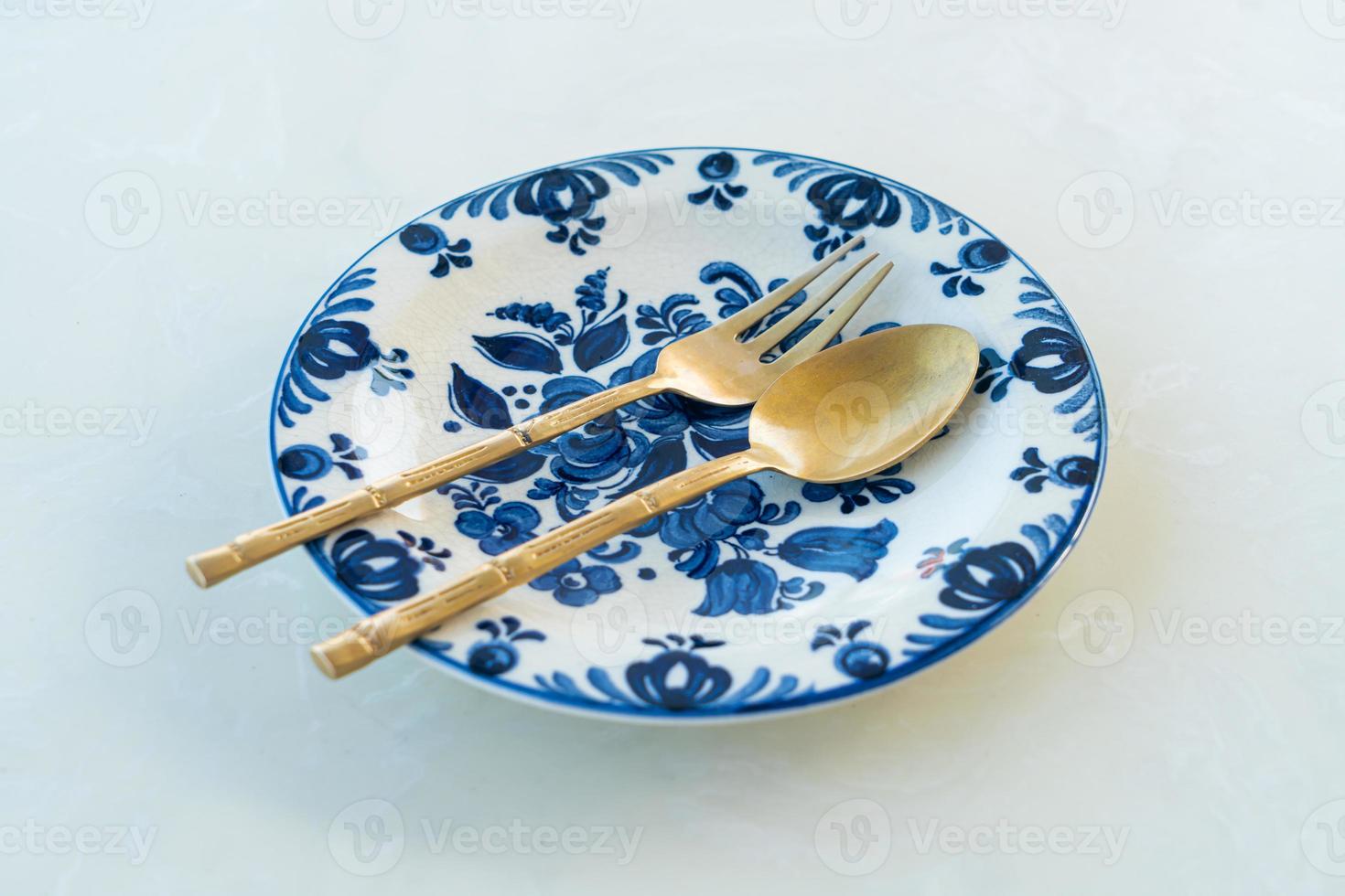 beautiful vintage porcelain plate on white table photo