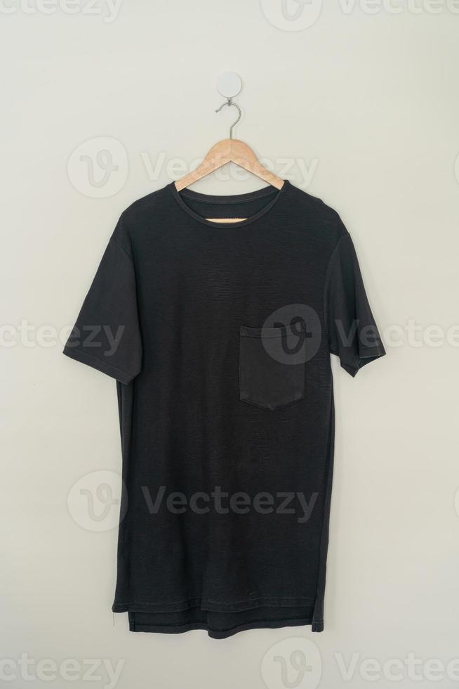 t-shirt hanging with wood hanger photo