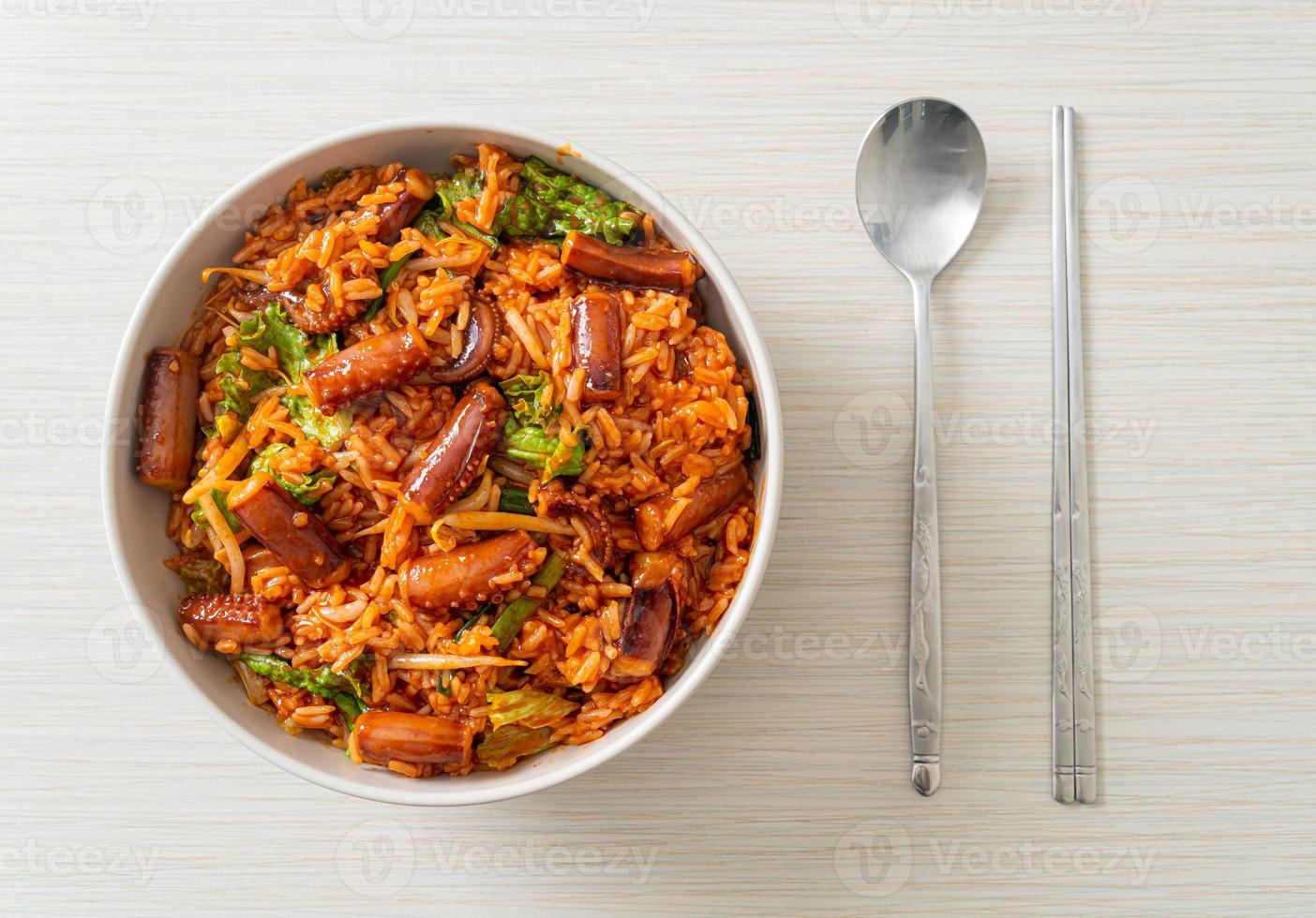 Stir-fried squid or octopus with Korean spicy sauce rice bowl photo