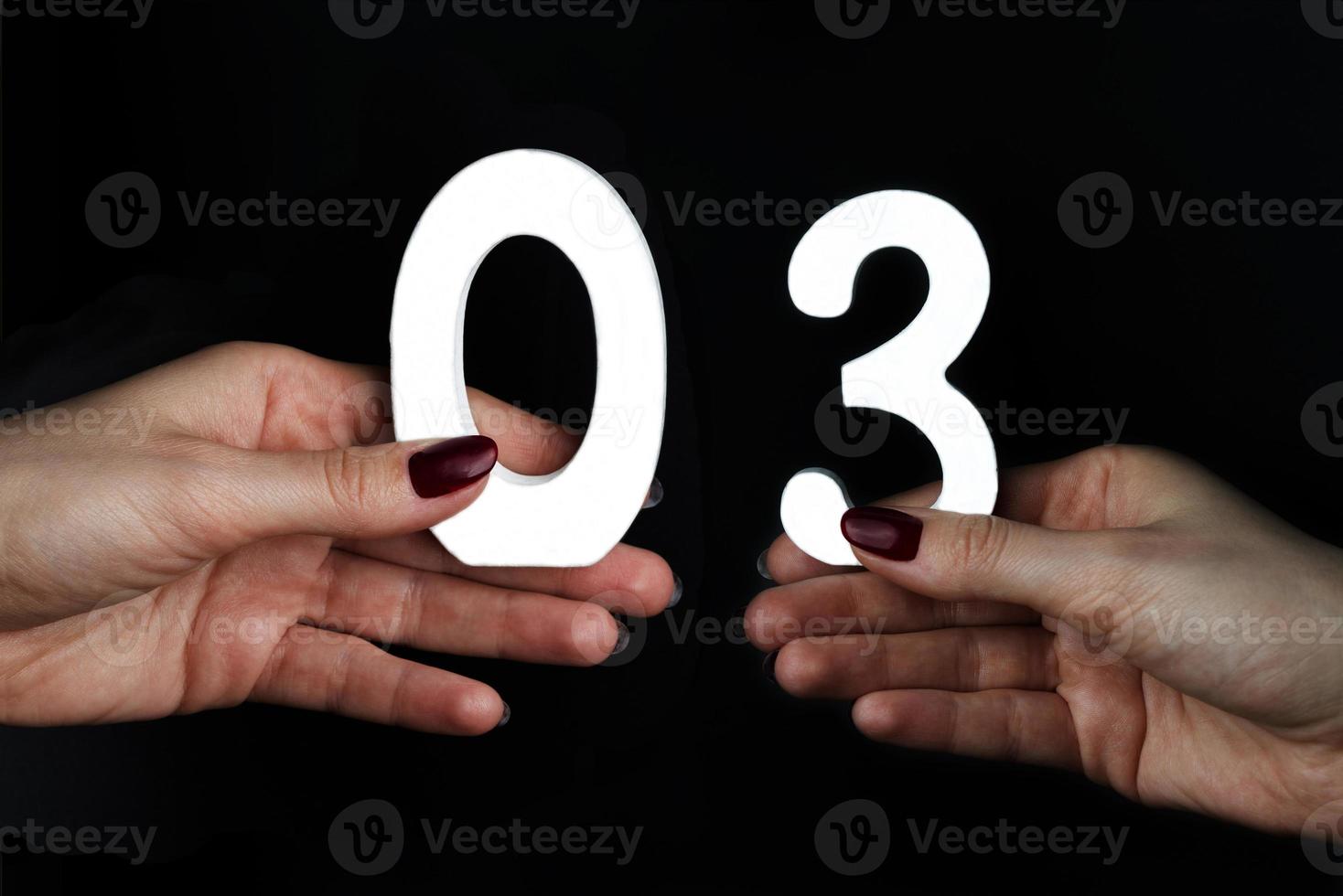 On the palms of the figure three and zero. photo