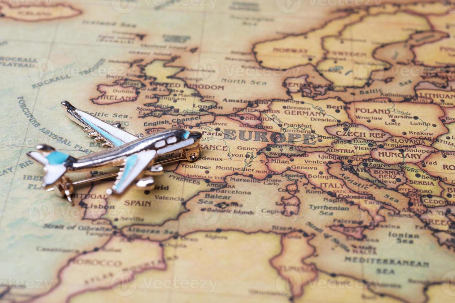 Airplane over the map of Europe close-up. photo