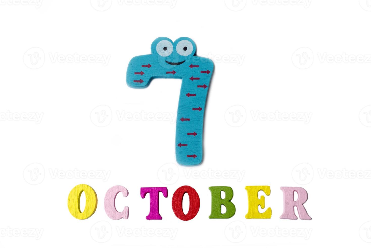 October 7 on white background, numbers and letters. photo