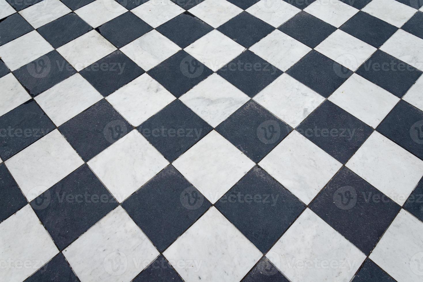 Black and white tiles. Chess floor. photo