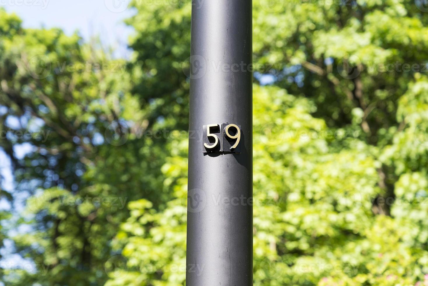 Number 59 house Number on the pole fifty-nine photo