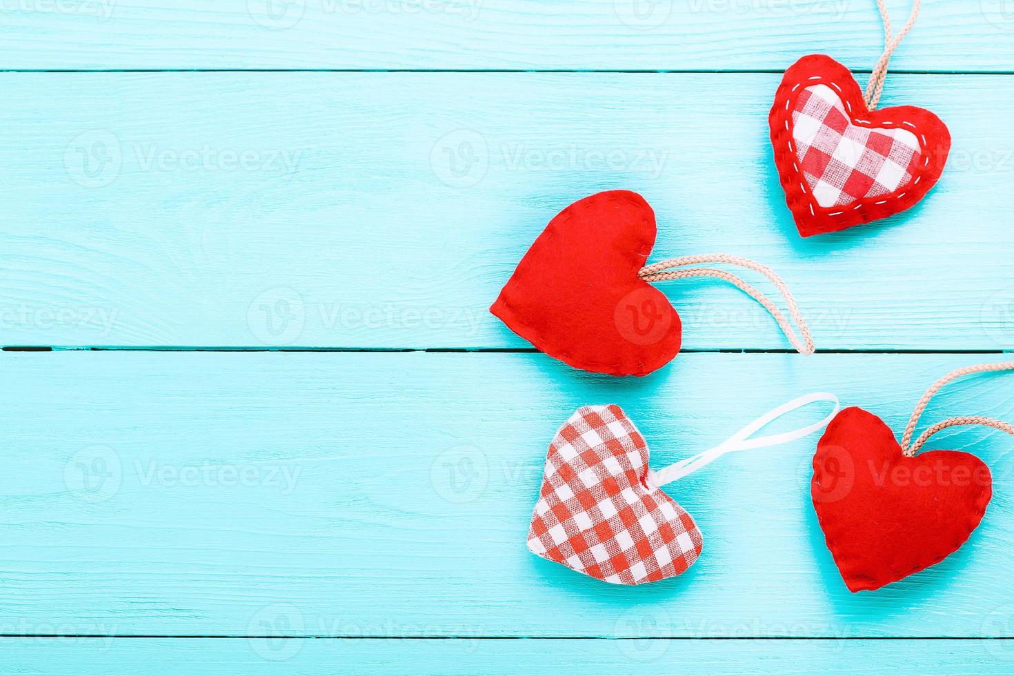 Hearts on blue wooden background. Valentines day. Top view photo