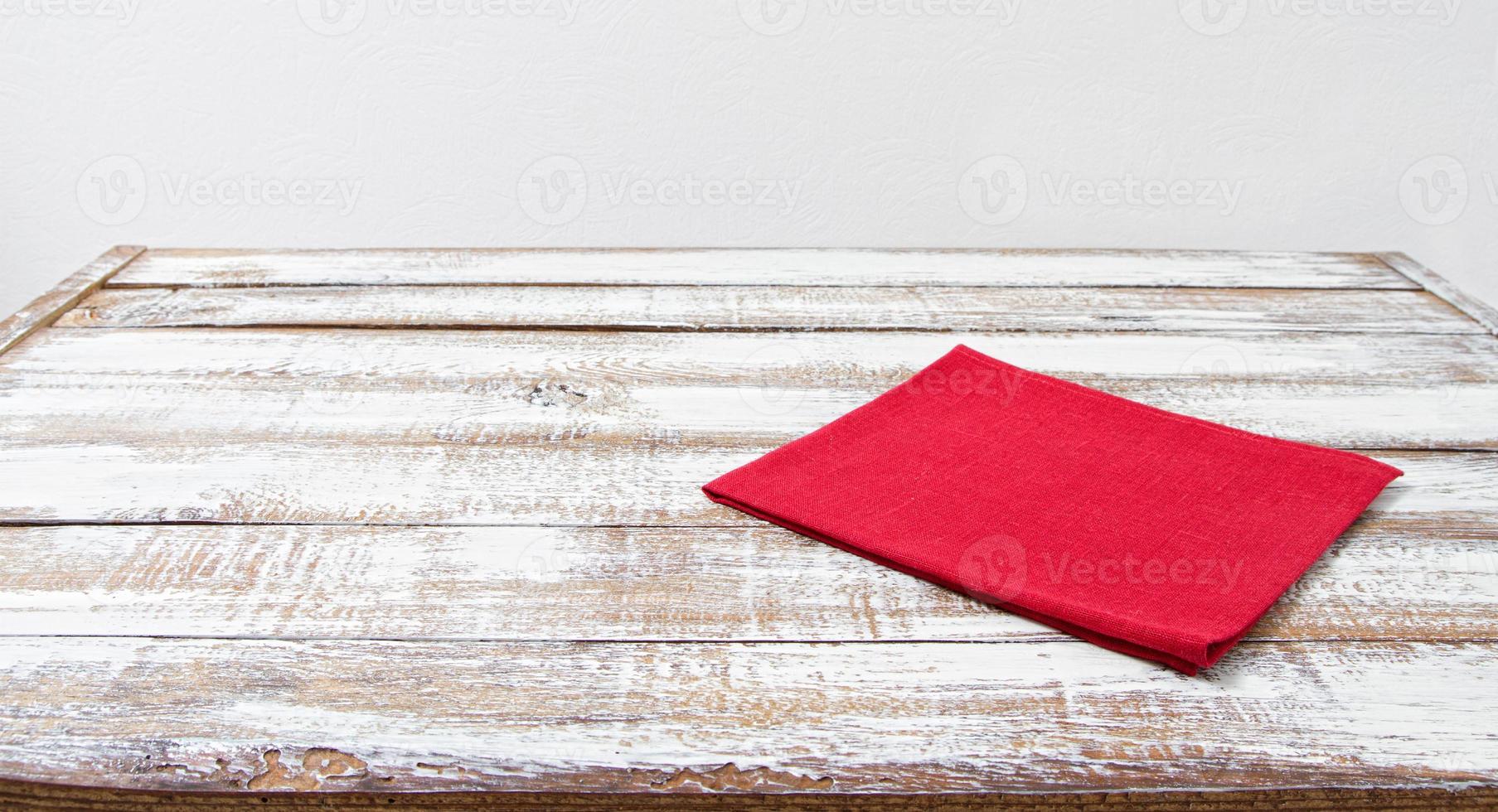red paper napkin on wooden table with copy space - Vintage Filter, copy space photo