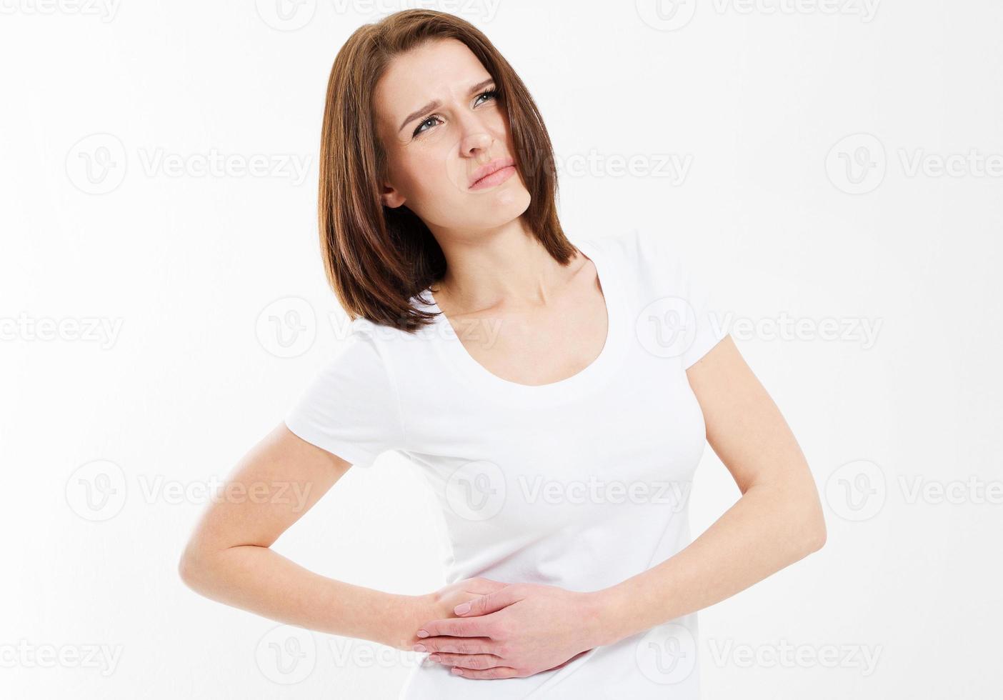 Young female woman having stomach ache isolated on white photo