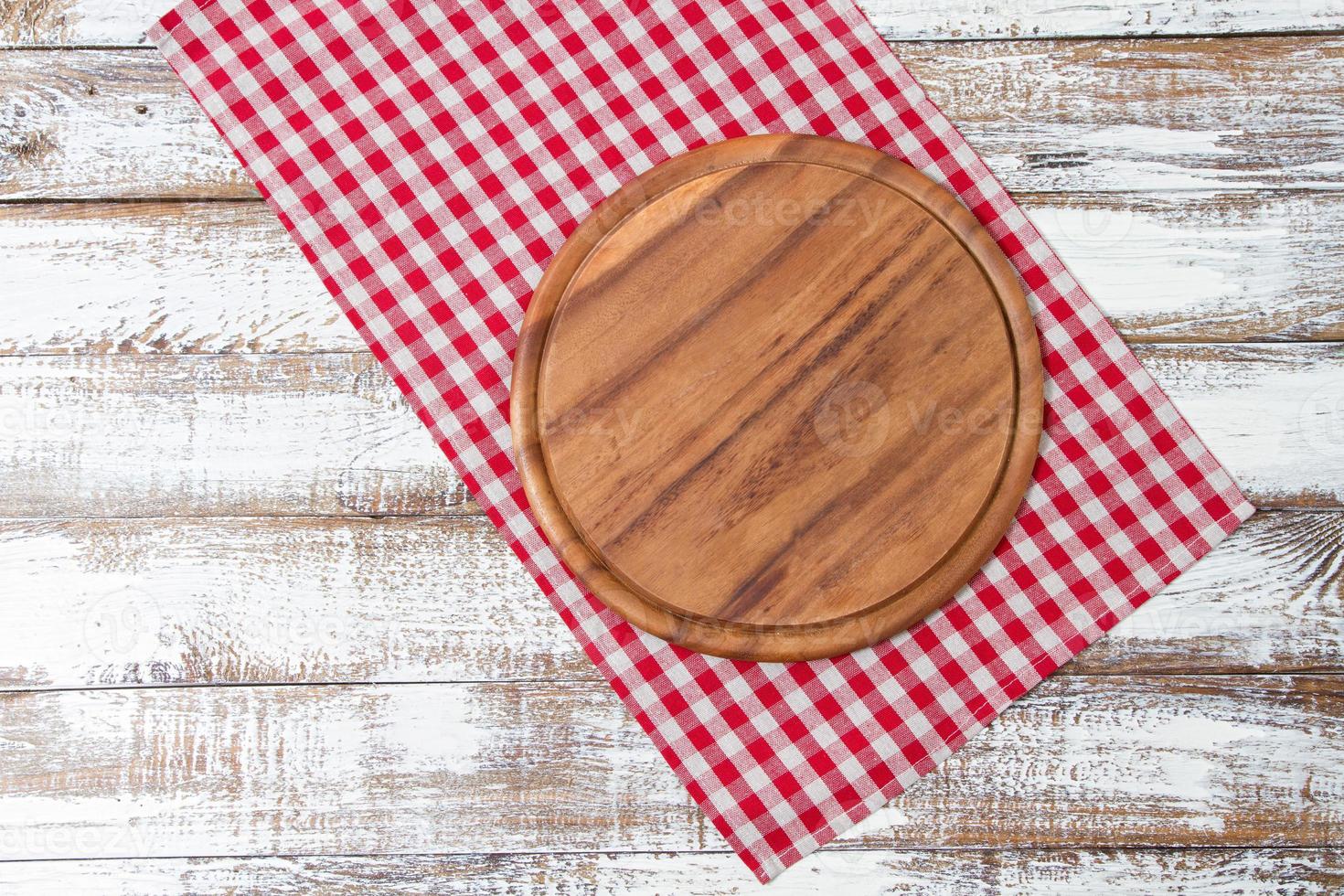 tablecloth and board for pizza on wooden desk closeup. Canvas, dish towels on white wooden table background top view mock up. Selective focus photo