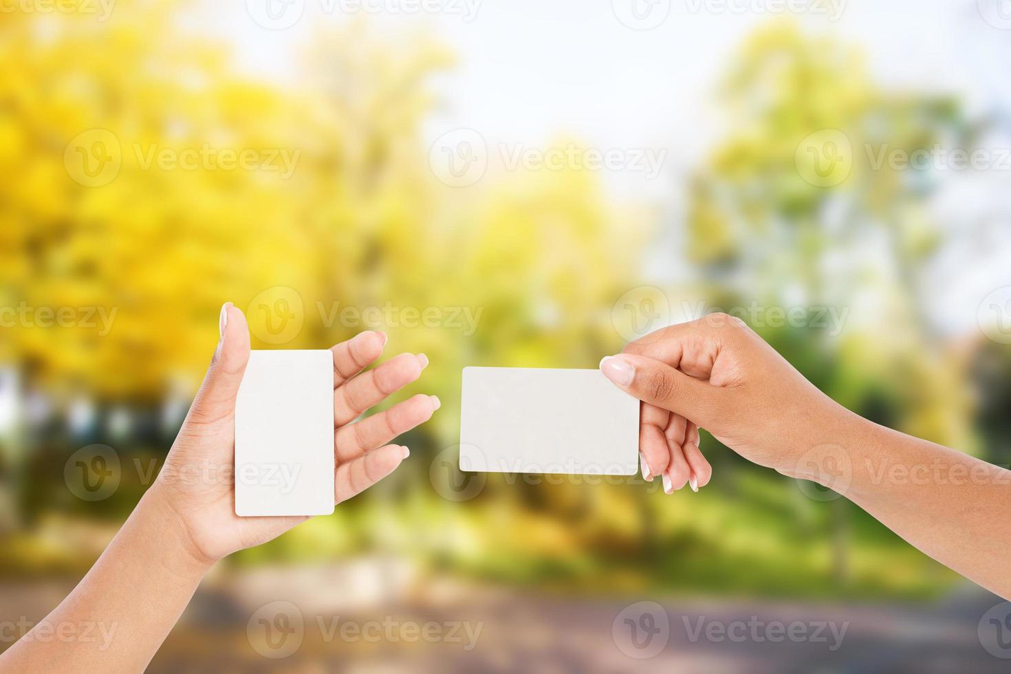 set afro american hands hold businesscard on blurred park background, business concept photo