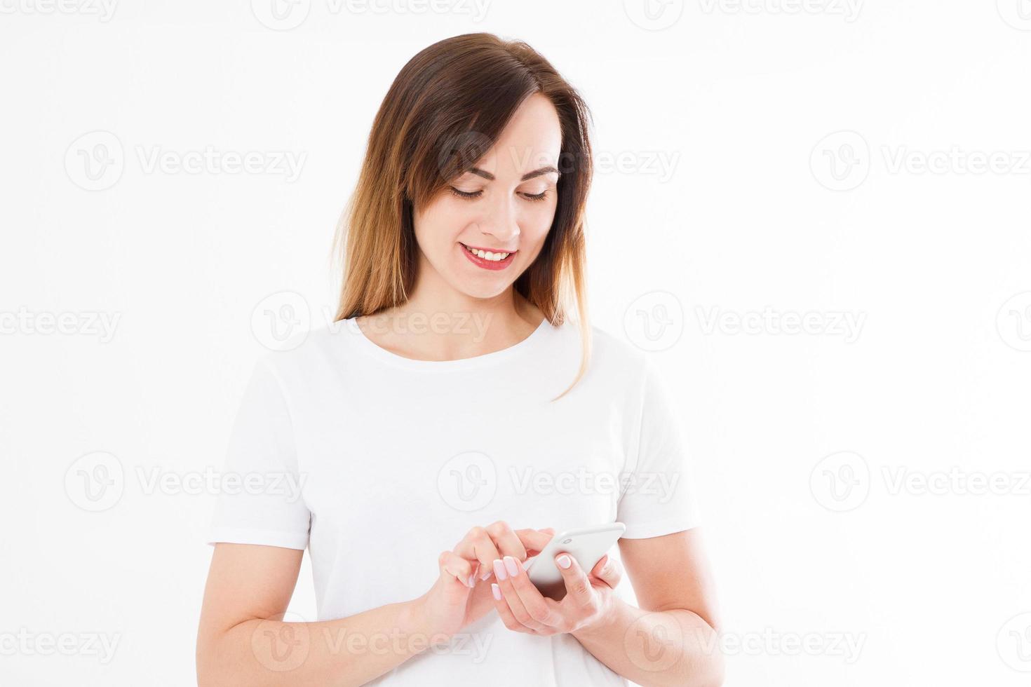 Charming joyful girl is reading pleasant text message on mobile phone from her boyfriend during her rest time. Smiling businesswoman is received positive feedback from customers on cell telephone photo