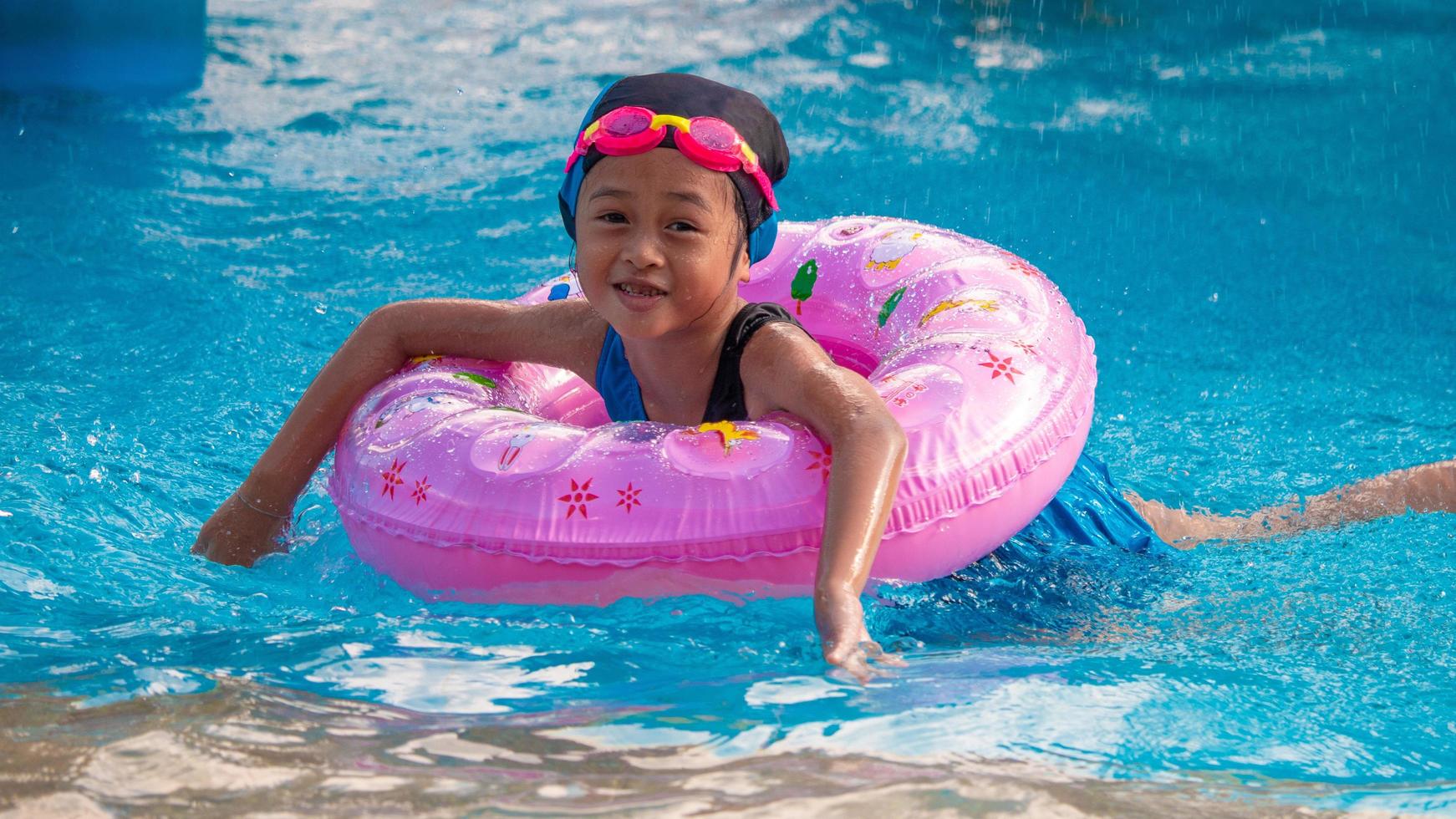 Children frolic at the water park. It is a sunny, perfect day for getting wet and playing hard photo