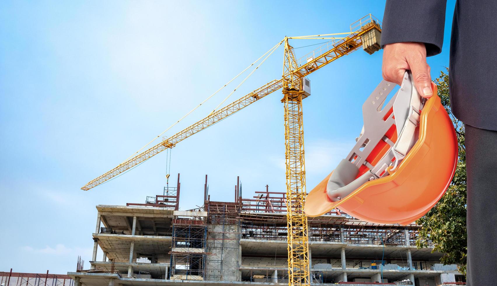 The site is under construction, a large building with a yellow crane photo