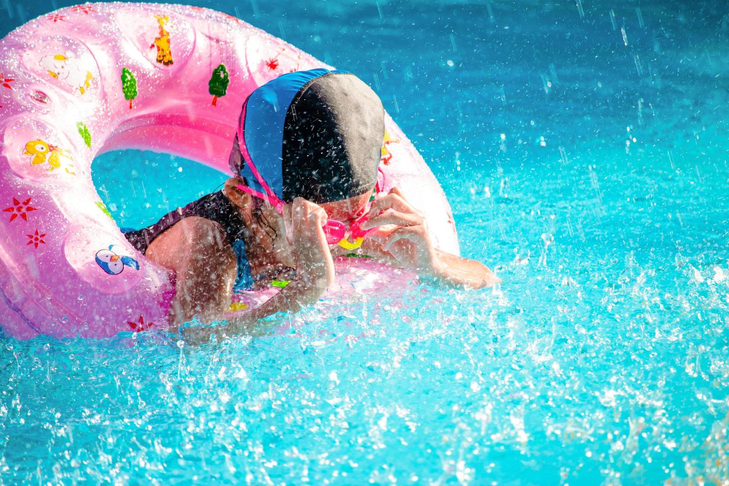 Children frolic at the water park. It is a sunny, perfect day for getting wet and playing hard. photo