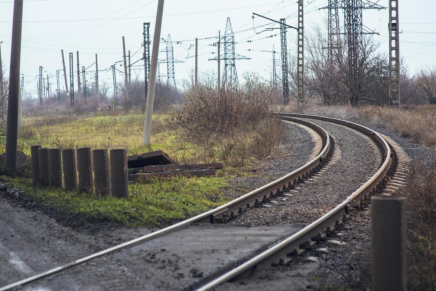 Railway tracks, rails, sleepers, train track. Railway track. Steel sleepers, curved shape. Turn by rail photo