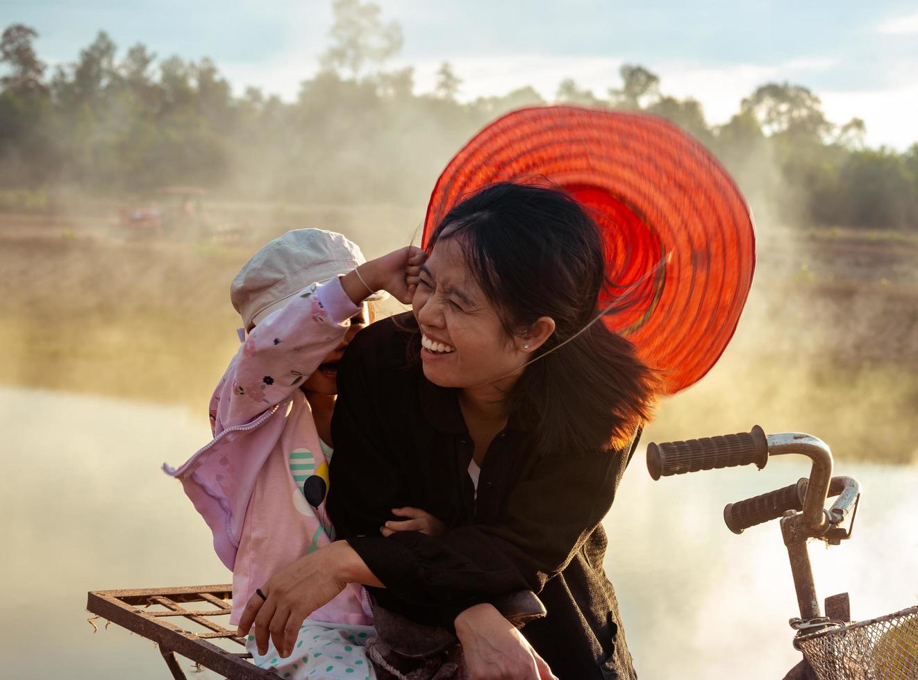 Mother and daughter in the countryside at sunset photo