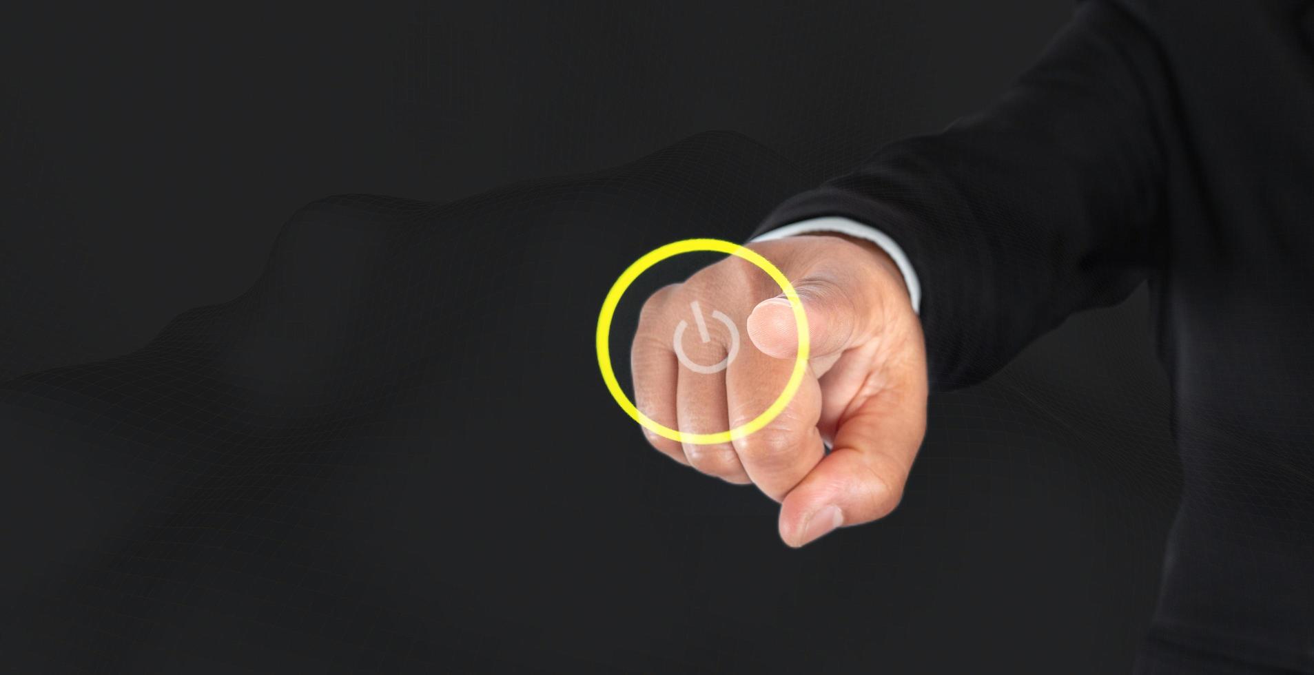 Businessman finger is about to hit the power button, business startup ideas photo
