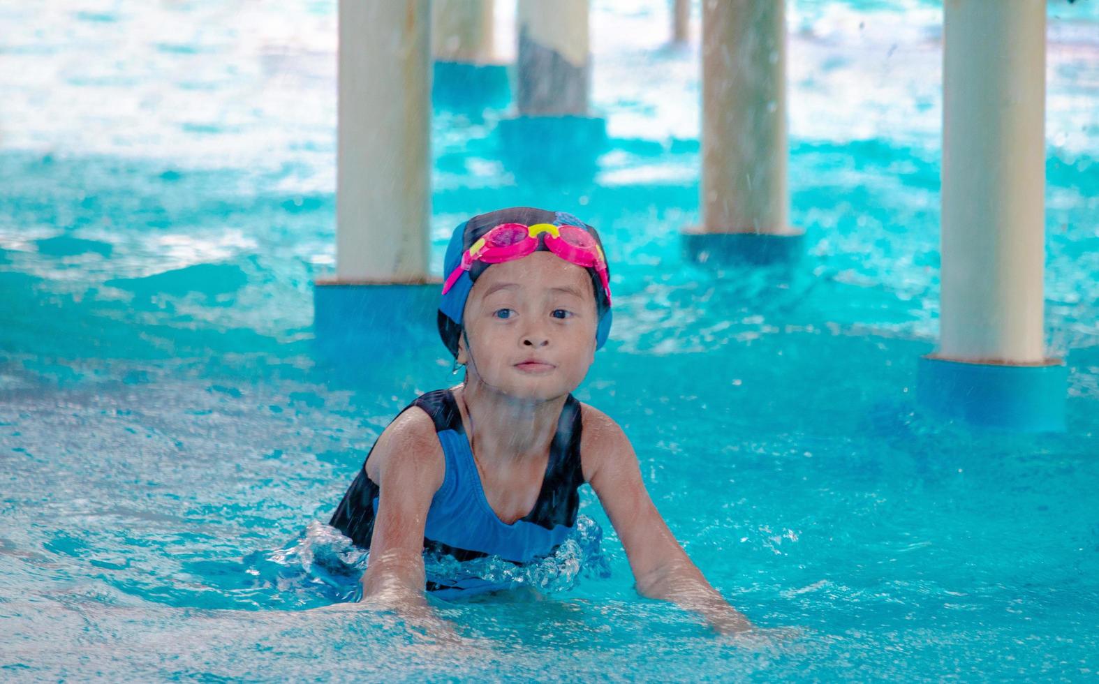 Children frolic at the water park. It is a sunny, perfect day for getting wet and playing hard photo