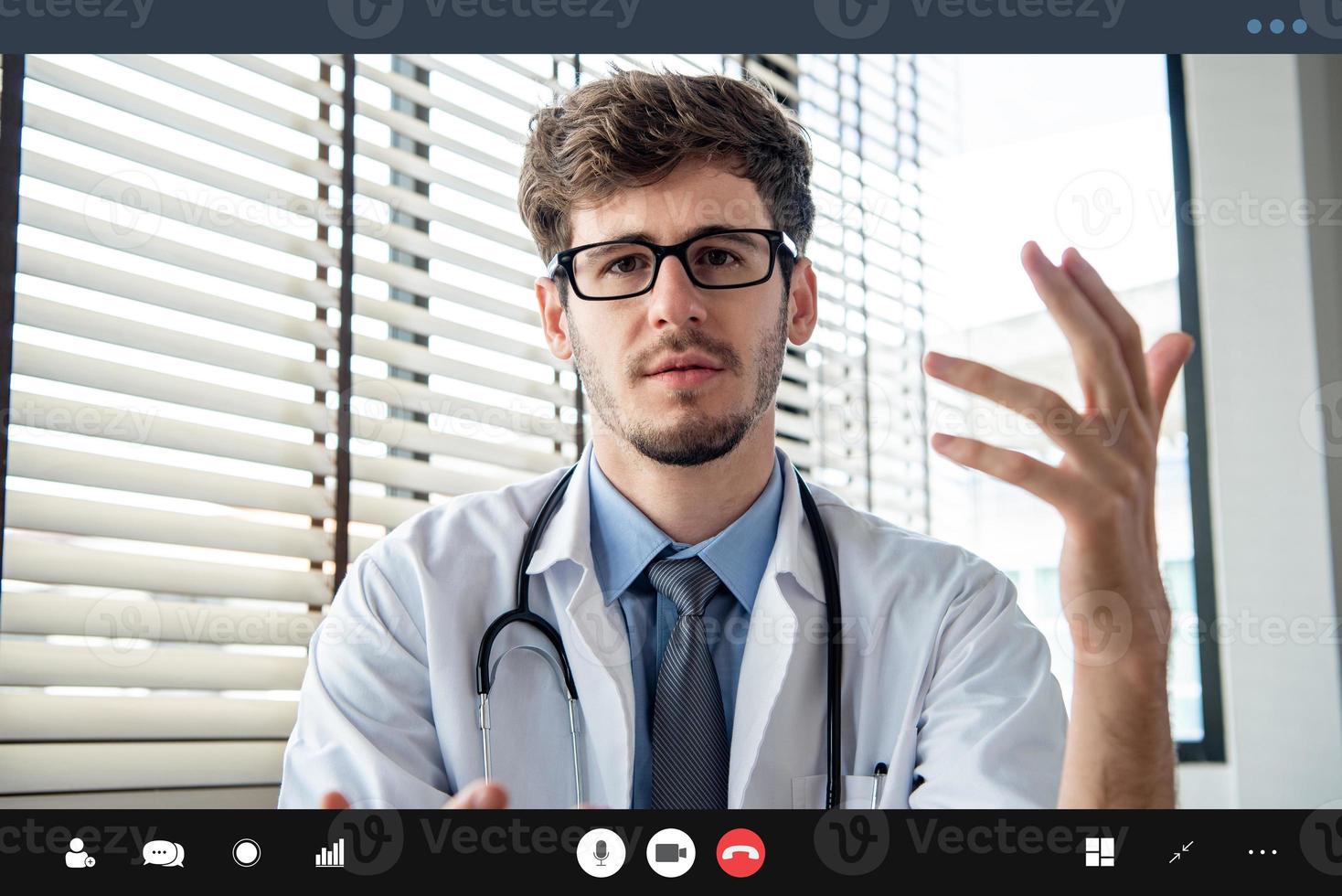 Male doctor making video call talking with patient, online medical
