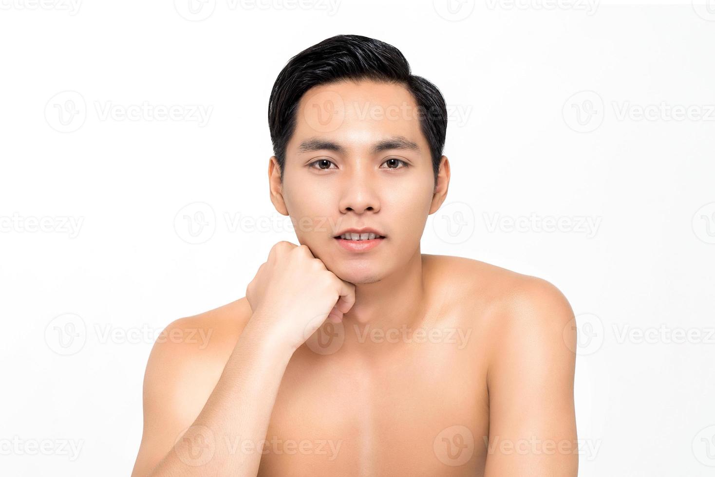 Shirtless handsome Asian man for beauty and skin care concepts isolated on white background photo