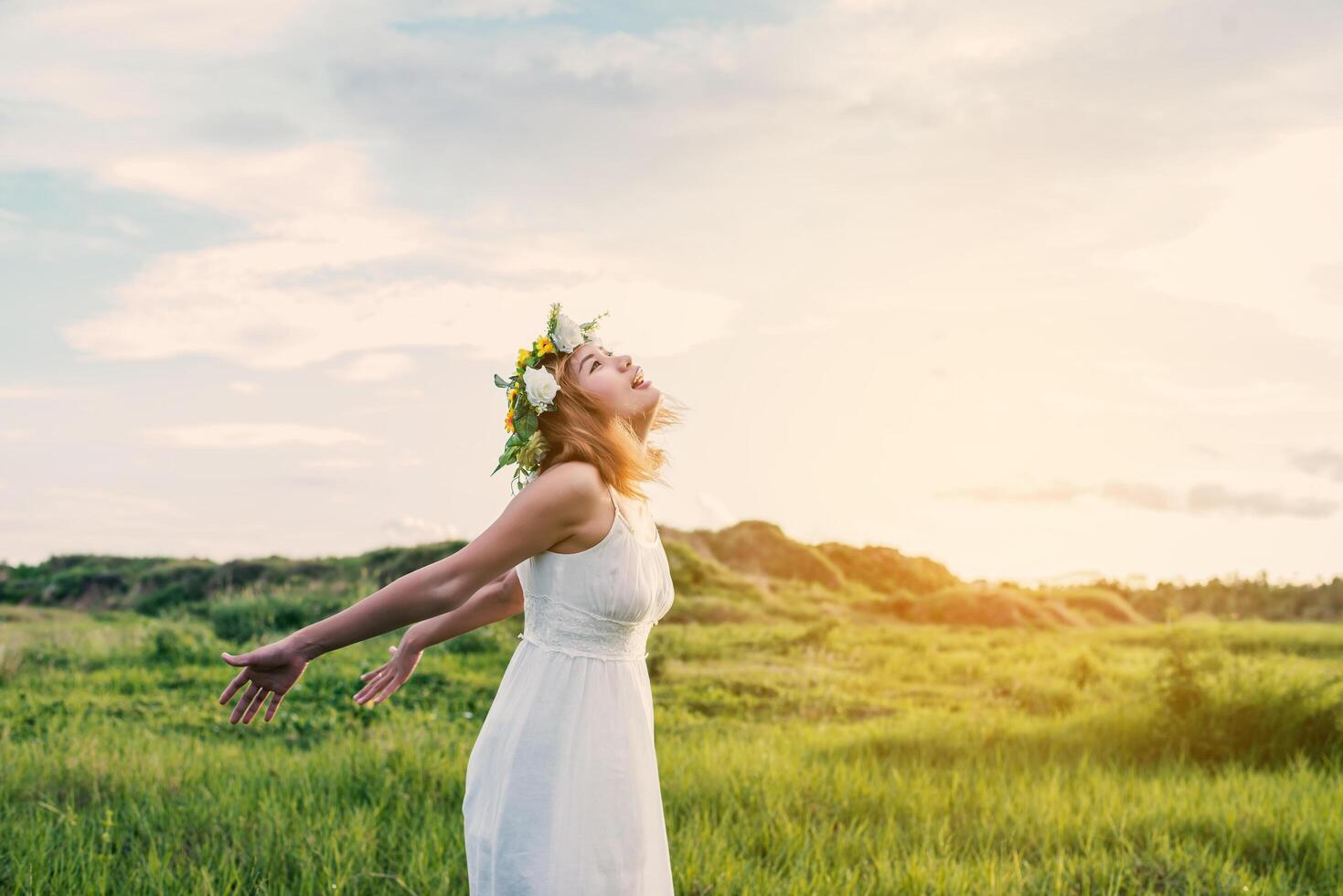 Young Happy Woman Enjoying Nature. photo