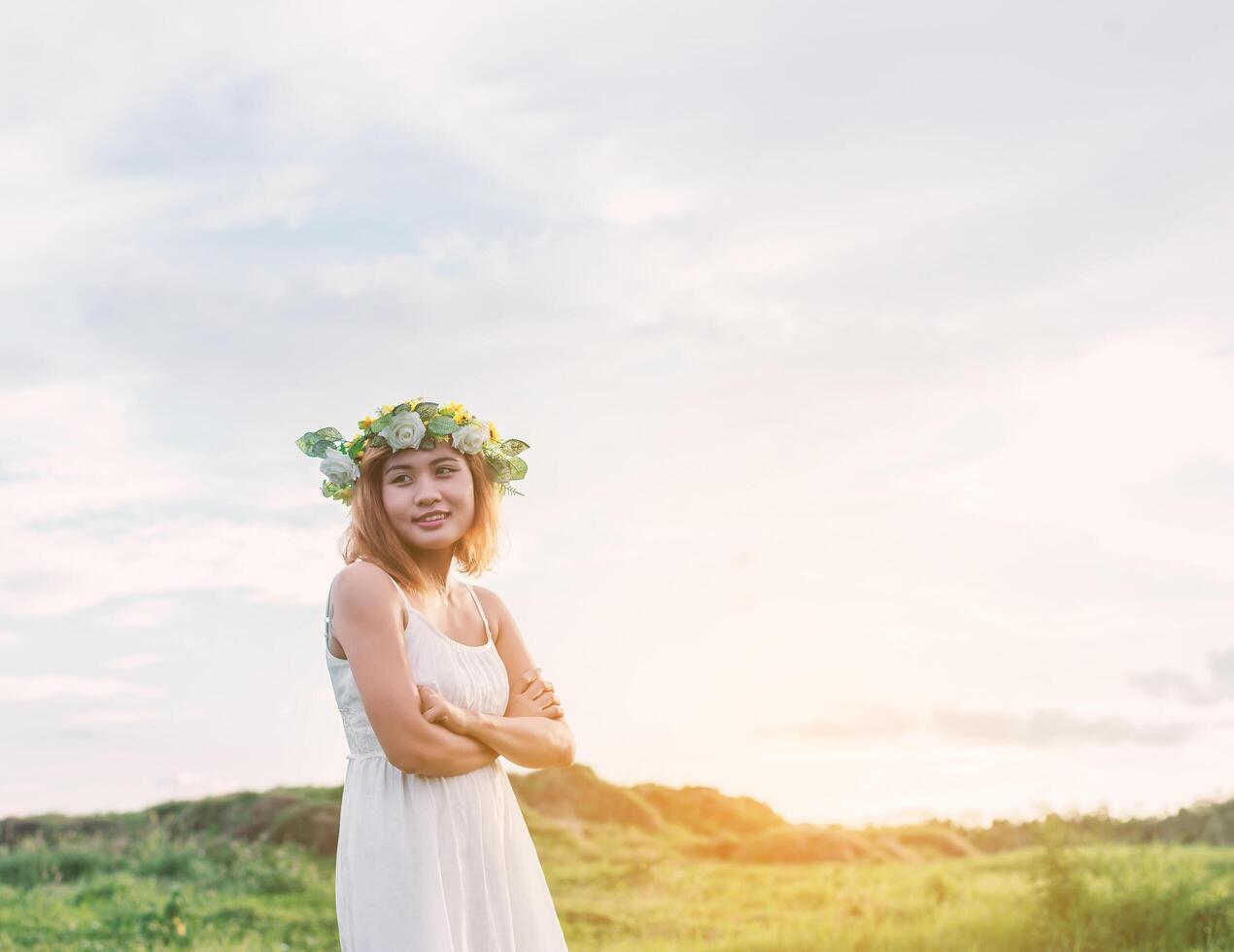 Freedom concept  Young beautiful woman enjoying with fresh air and nature at meadows. photo