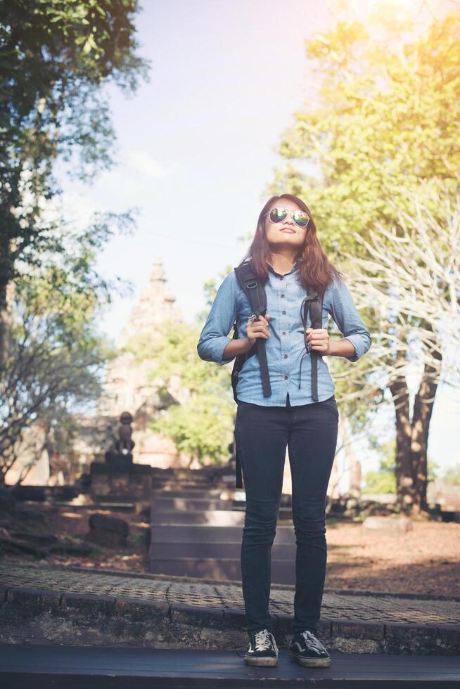 Young attractive woman take some resting while traveling at phnom rung temple in thailand. photo