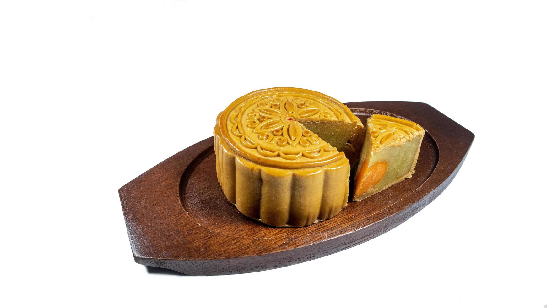 Mooncake, mid autumn festival cake on the wooden dish photo