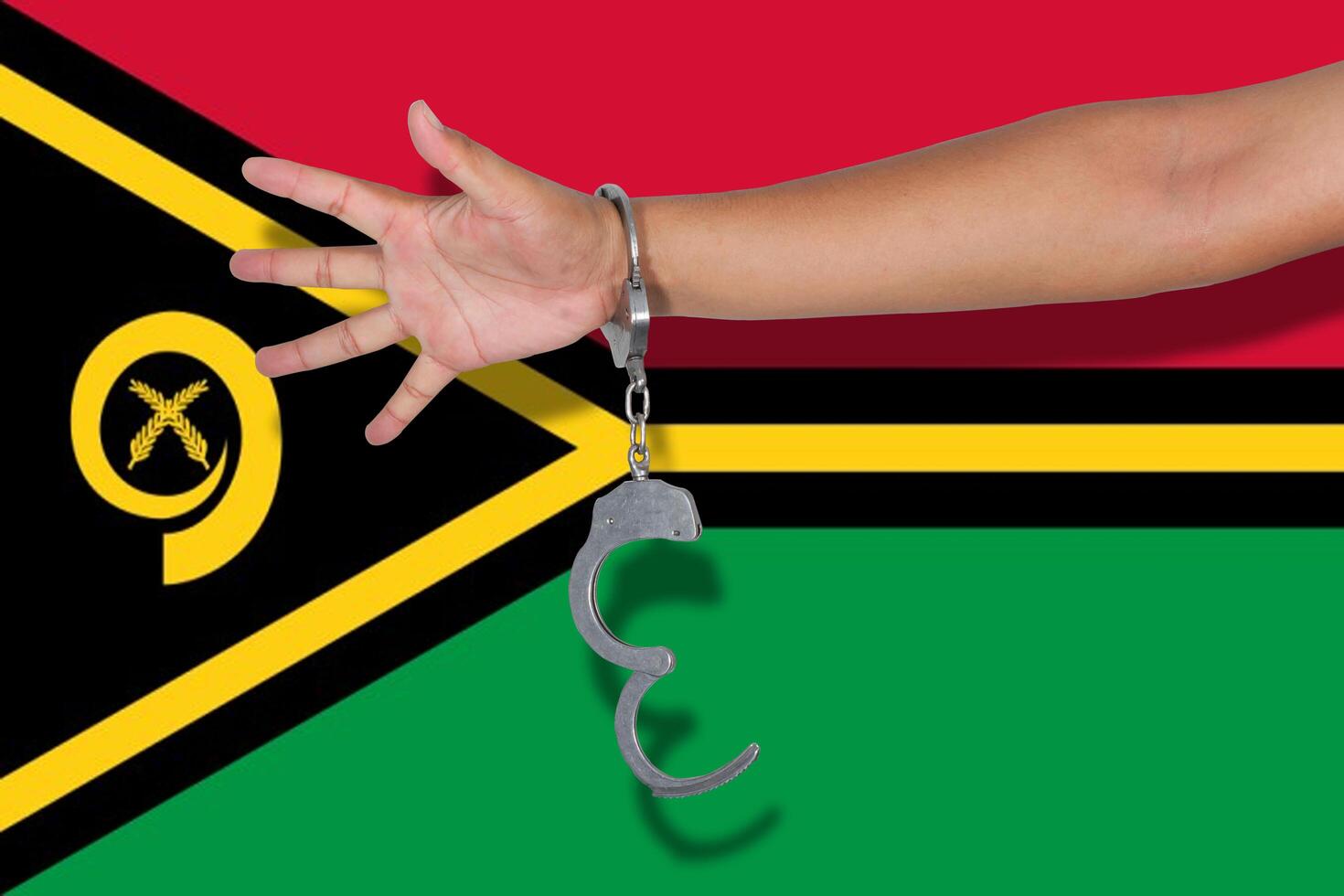 handcuffs with hand on Vanuatu flag photo