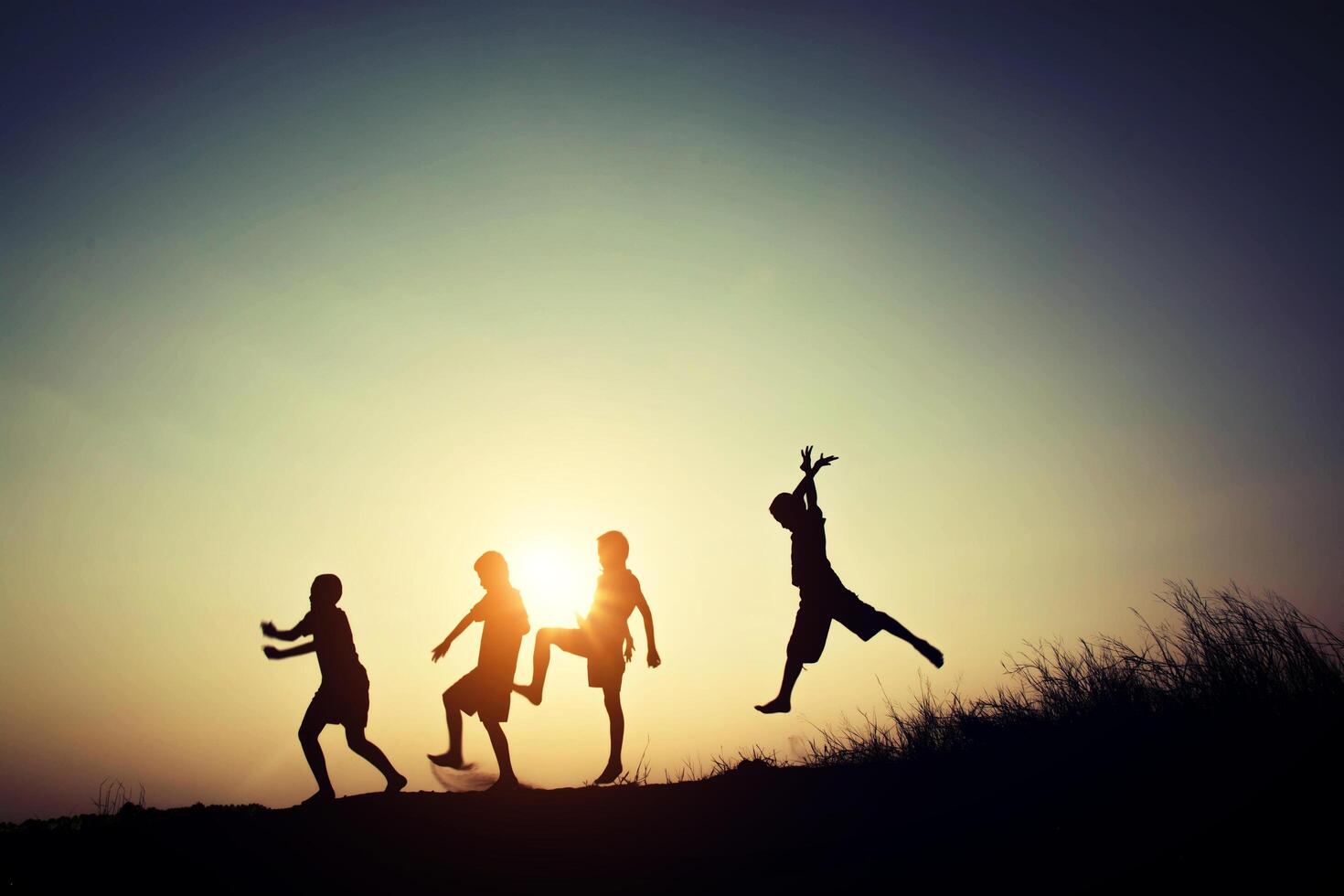 Children playing on summer sunset happy time photo