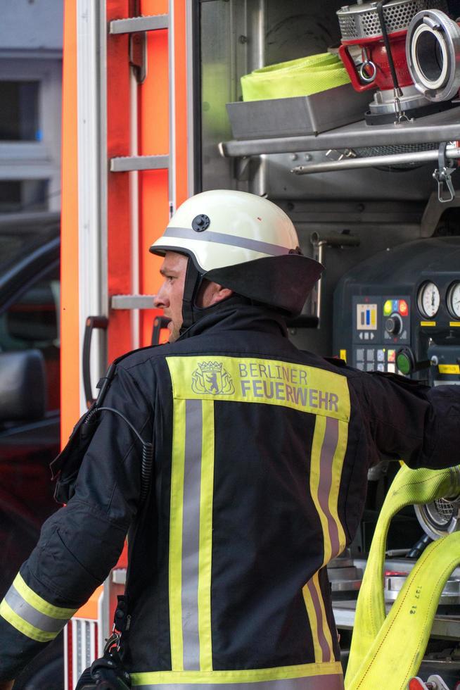 Back turned Berliner fire department firefighter at work photo