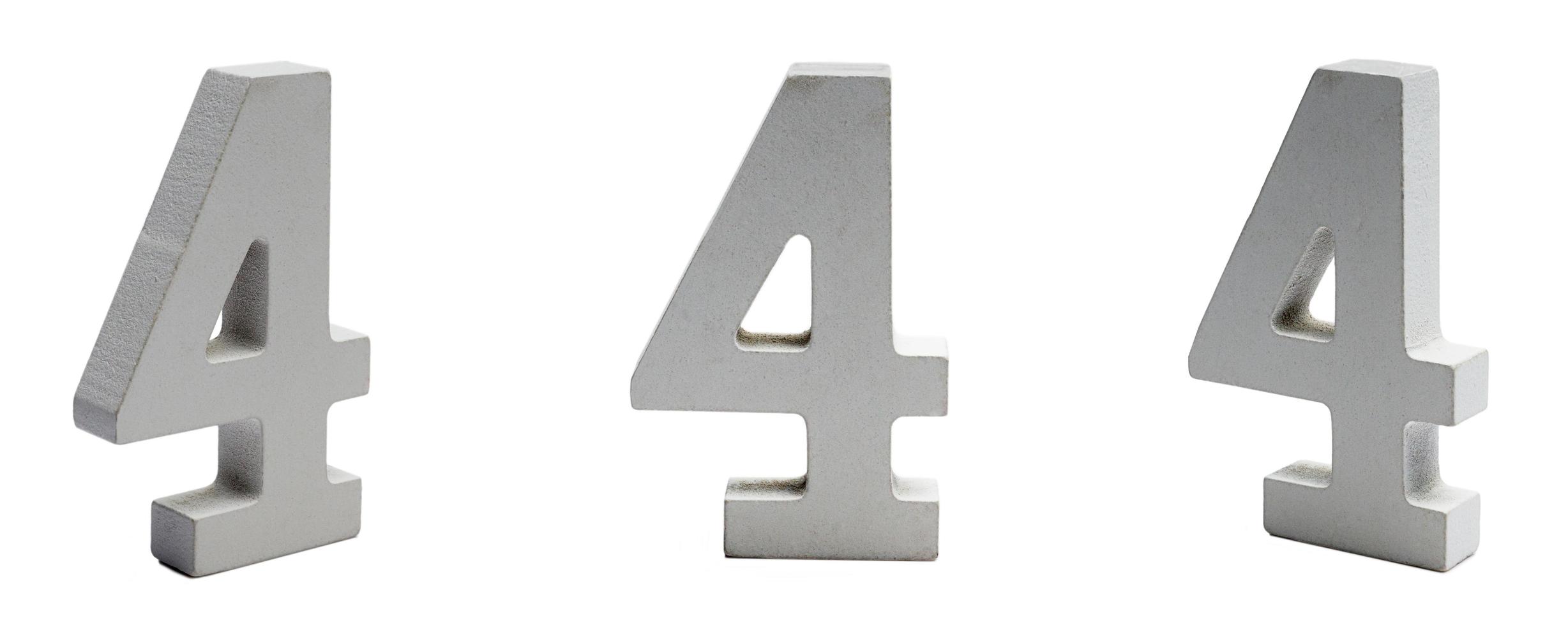 Figure four made of plaster on a white background at different angles. photo