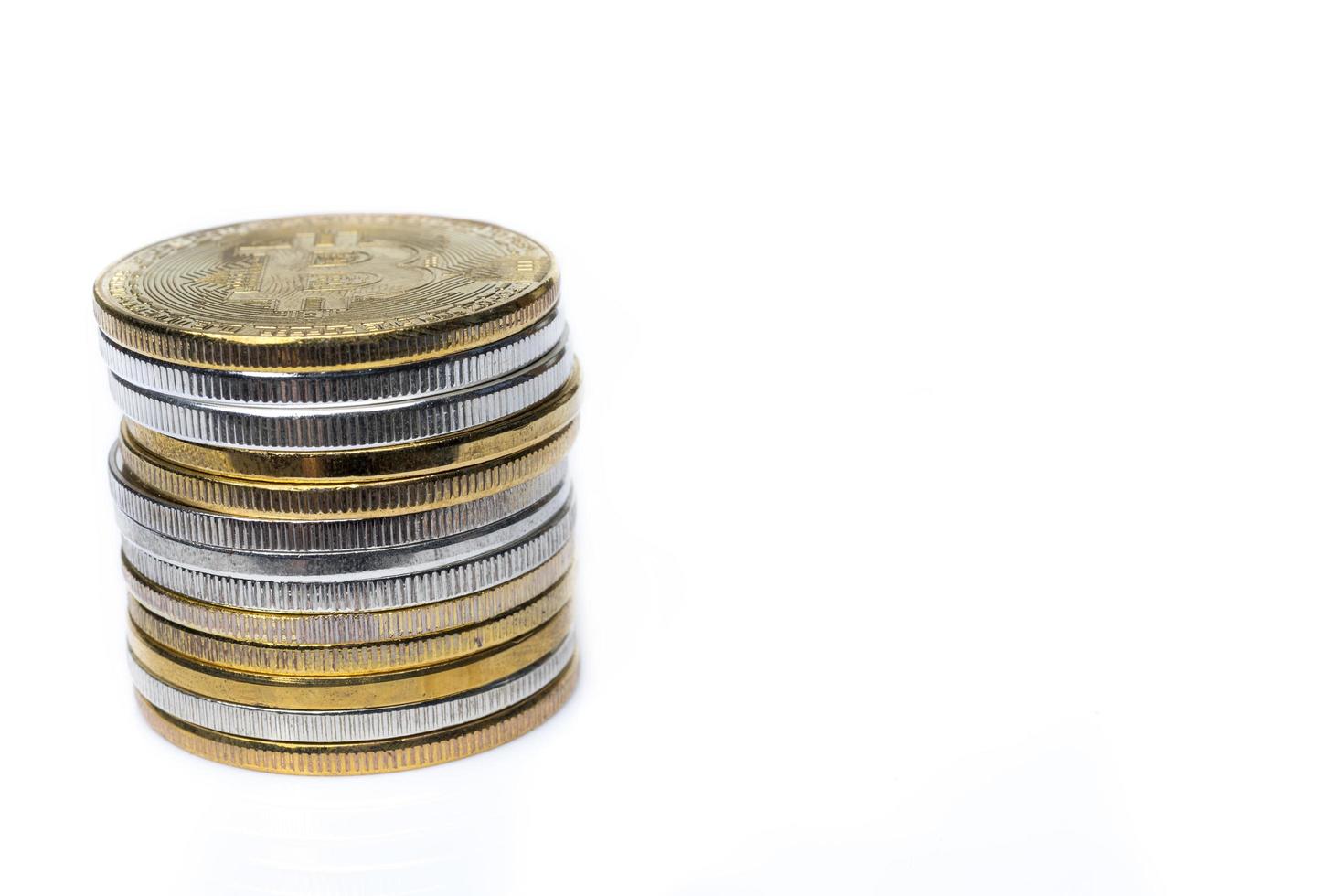 One stack of bitcoins on a white background. photo