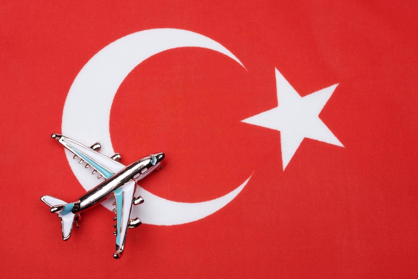 Flag of Turkey and the plane. The concept of travel. photo