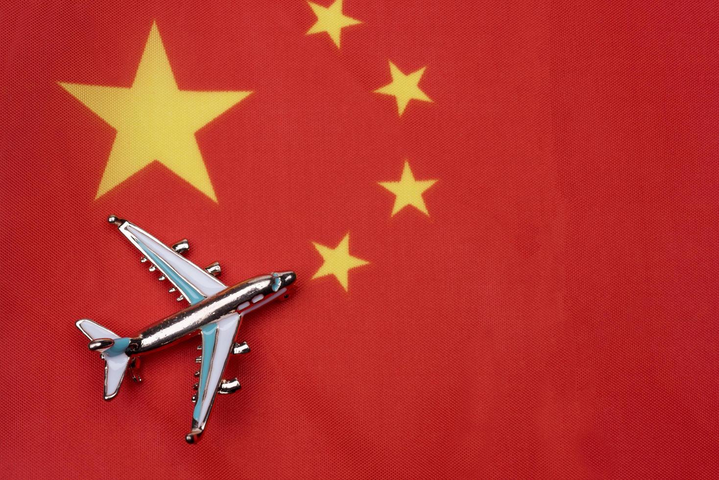 The flag of China and the plane. The concept of travel. photo