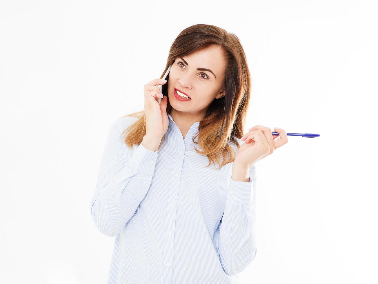 Isolated portrait of business girl with smartphone. Woman tolking on phone. Confident young manager. Copy space photo