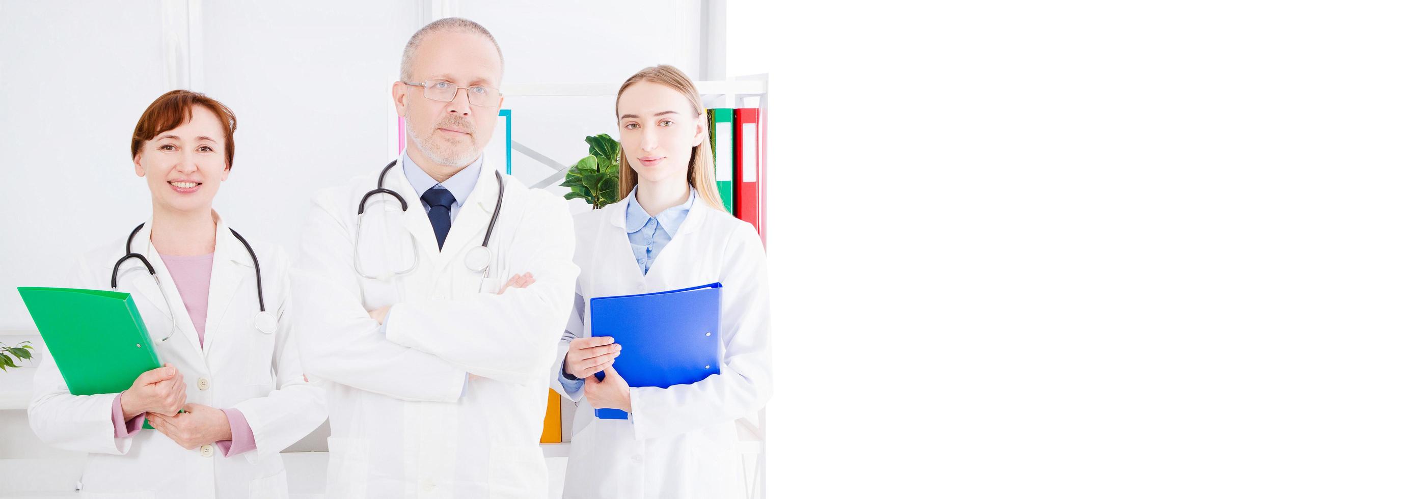 doctor posing with medical staff,nurse in office and copy space, banner of billboard photo