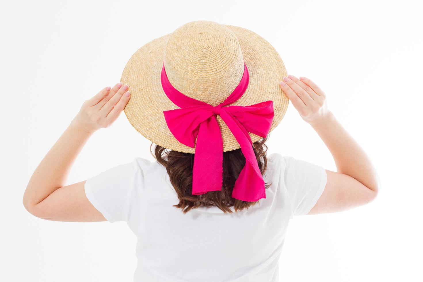 Closeup of woman in summer beach hat back view isolated on white background. Template t shirt rear view. Vacation and fun holidays concept. Copy space photo