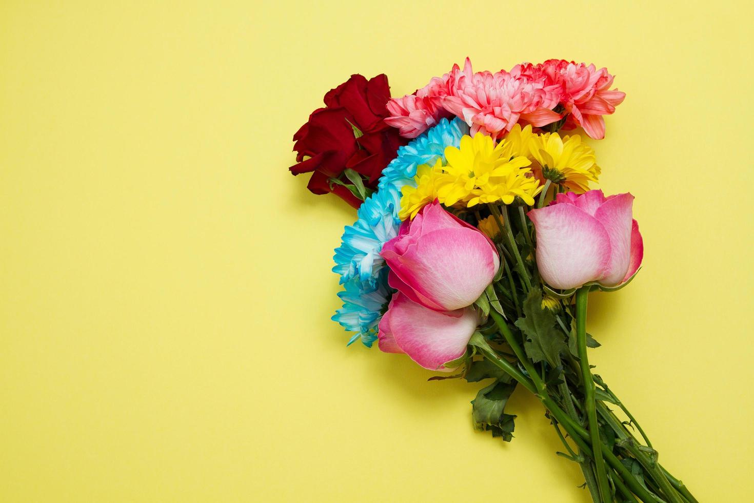 Send flowers online concept. Flower delivery for valentine and mother day. Bouquet of red pink roses isolated on violet background. Post card design with beautiful nature rose. Top view. copy space. photo