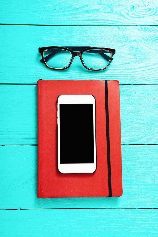 Workplace with business accessories on blue wooden background. Top view and copy space photo