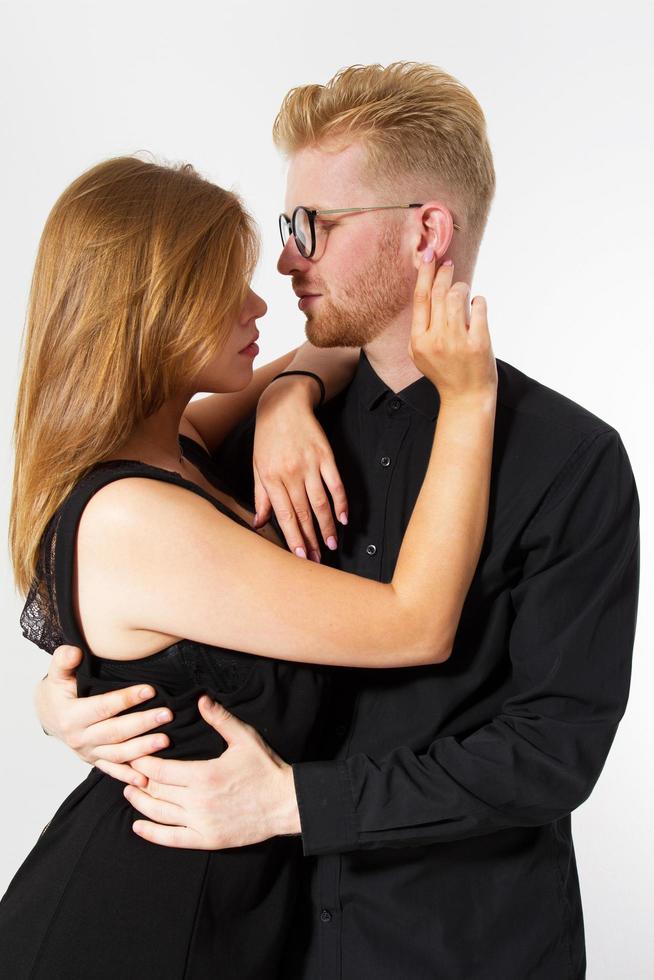 Beautiful teen couple passion portrait isolated on white background photo