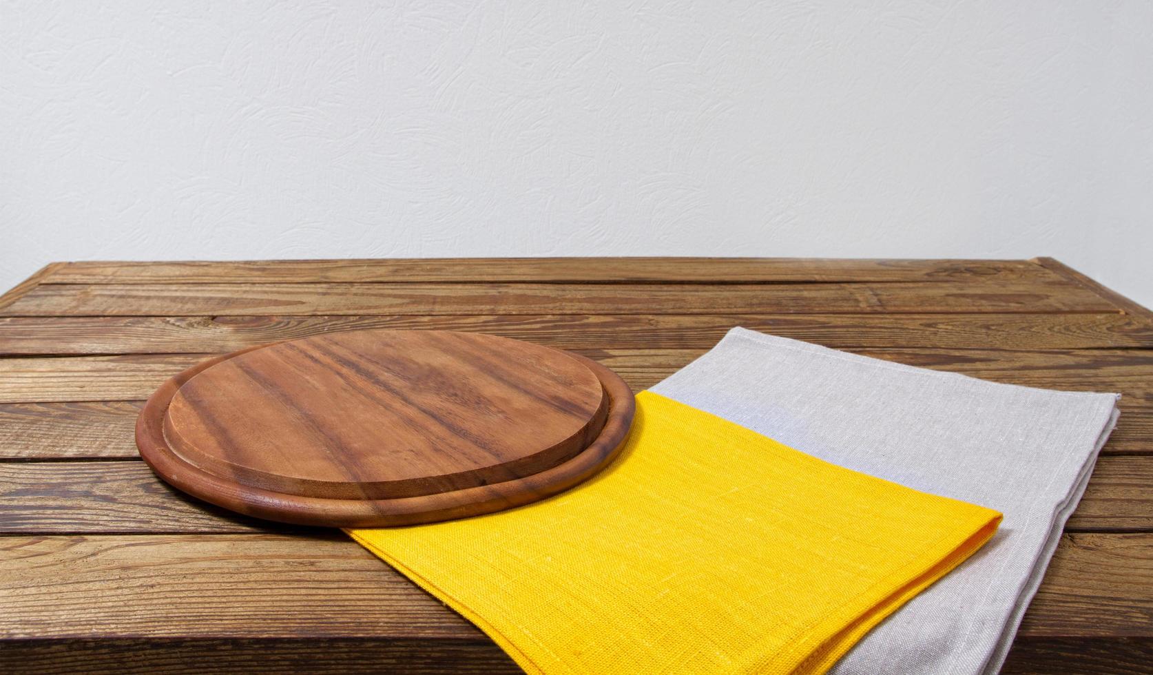 pizza desk, yellow grow napkins on empty wooden table, copy space photo