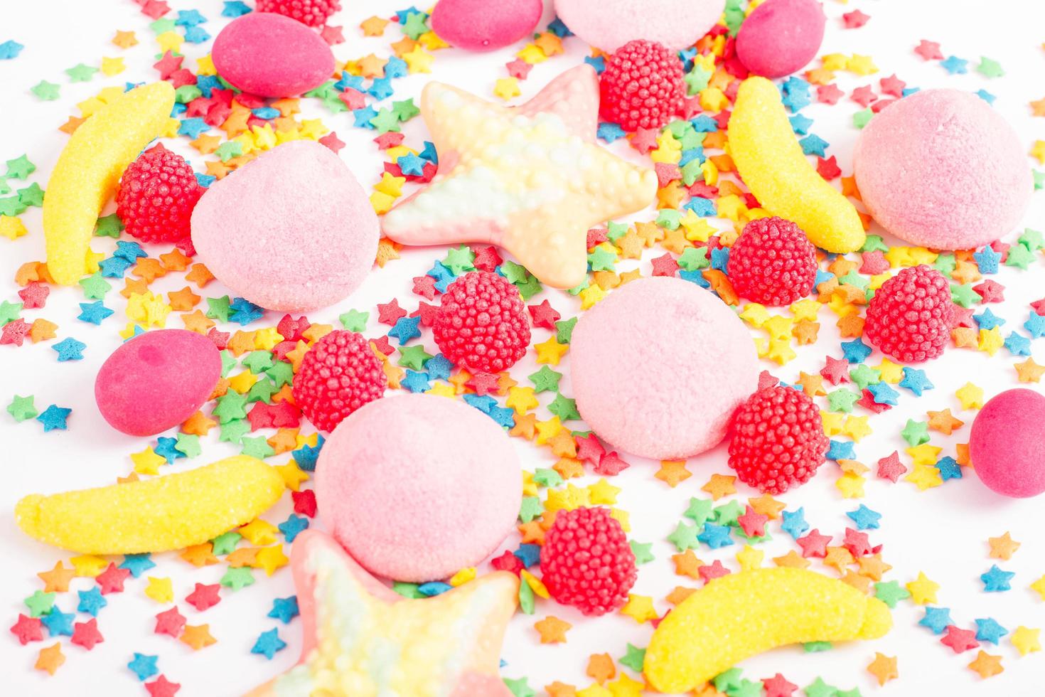 Colorful candy, lollipop and sweets isolated on white background. Top view. Selective focus. photo
